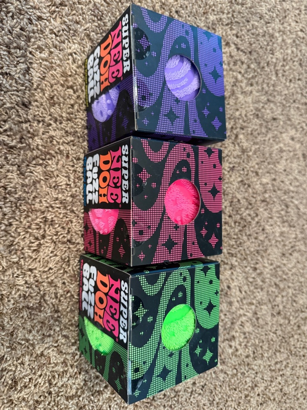 Lot of three SUPER NeeDoh Fuzz Ball Plush Stress Toy - Pink, Green, and Purple - Picture 2 of 2